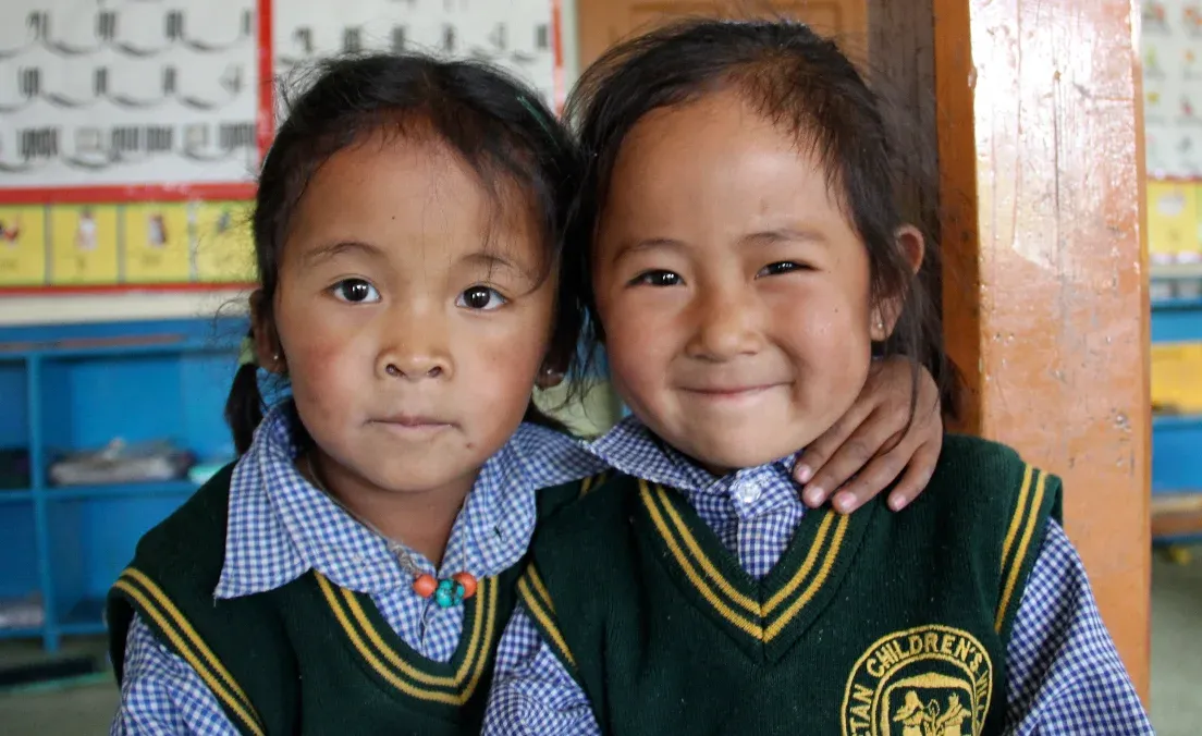 Tibetan children in a classroom, focused on their studies